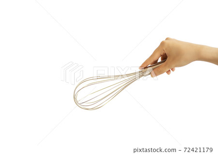 Female hand holding a whisk [white background] 72421179