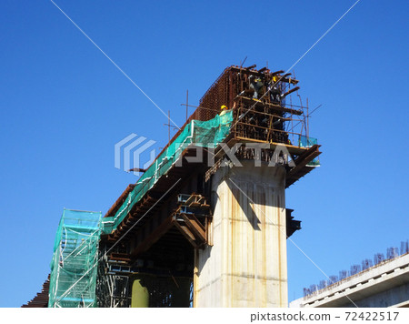 MALACCA, MALAYSIA -MARCH 2, 2020: Construction workers working at height at the construction site. They are supplied with harnesses and other safety equipment to prevent them from having an accident. 72422517