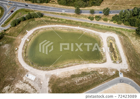 Aerial view of a rain retention basin  72423089