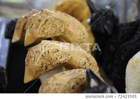 SEREMBAN, MALAYSIA -MAY 01, 2017: Kris Holders made of wood and ivory. It is designed to hold kris blade, the traditional weapon of the Malay in Malaysia. SEREMBAN, MALAYSIA -MAY 01, 2017: Kris Holders made of wood and ivory. It is designed to hold kris blade, the traditional weapon of the Malay in Malaysia. 72423505