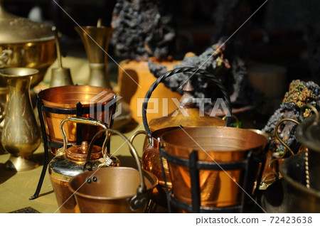 SEREMBAN, MALAYSIA -MAY 01, 2017: Old pottery made of copper widely used by the Malays. Displayed to the public. SEREMBAN, MALAYSIA -MAY 01, 2017: Old pottery made of copper widely used by the Malays. Displayed to the public. 72423638