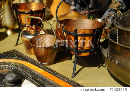 SEREMBAN, MALAYSIA -MAY 01, 2017: Old pottery made of copper widely used by the Malays. Displayed to the public. SEREMBAN, MALAYSIA -MAY 01, 2017: Old pottery made of copper widely used by the Malays. Displayed to the public. 72423639