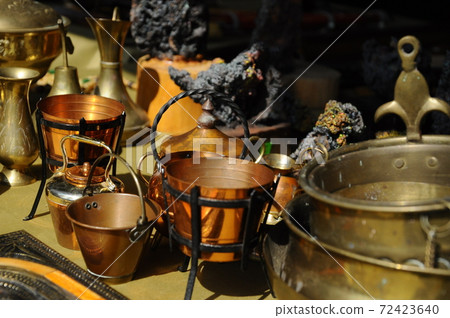 SEREMBAN, MALAYSIA -MAY 01, 2017: Old pottery made of copper widely used by the Malays. Displayed to the public. SEREMBAN, MALAYSIA -MAY 01, 2017: Old pottery made of copper widely used by the Malays. Displayed to the public. 72423640