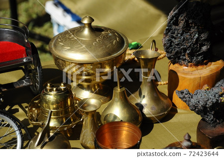 SEREMBAN, MALAYSIA -MAY 01, 2017: Old pottery made of copper widely used by the Malays. Displayed to the public. 72423644