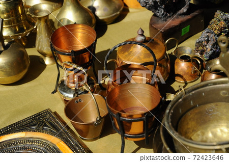 SEREMBAN, MALAYSIA -MAY 01, 2017: Old pottery made of copper widely used by the Malays. Displayed to the public. SEREMBAN, MALAYSIA -MAY 01, 2017: Old pottery made of copper widely used by the Malays. Displayed to the public. 72423646