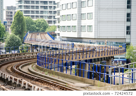 Docklands Light Railway tracks and skyscrapers east of London 72424572