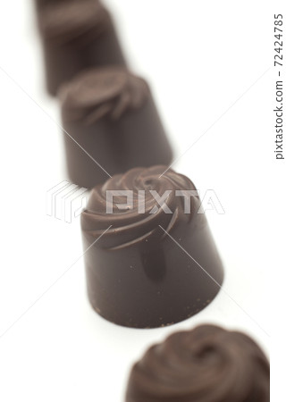 Closeup of chocolate collection on white background Closeup of chocolate collection on white background 72424785