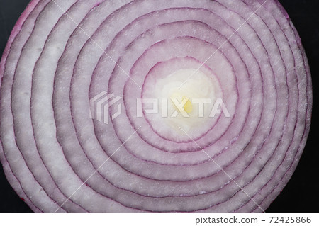Sliced red onion rings, closeup top view of healthy food on black background, vegetable of rich Sliced red onion rings, closeup top view of healthy food on black background, vegetable of rich 72425866