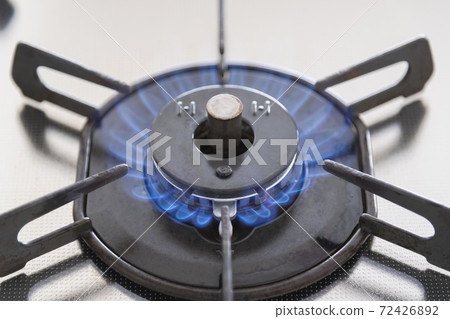 A lit gas stove 72426892