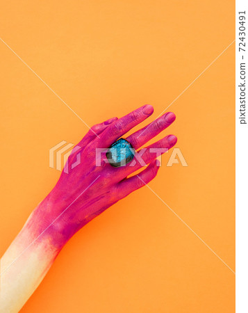 Body paint or art makeup on marigold background. 72430491