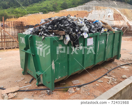 KUALA LUMPUR, MALAYSIA -MARCH 13, 2020: Huge wasted disposal bin used to collect rubbish and unused material from the construction site. Has a fixed collection schedule 72431988
