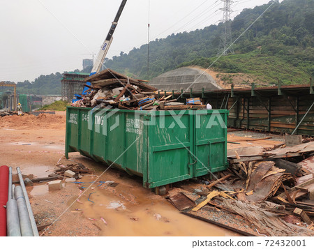 KUALA LUMPUR, MALAYSIA -MARCH 13, 2020: Huge wasted disposal bin used to collect rubbish and unused material from the construction site. Has a fixed collection schedule 72432001