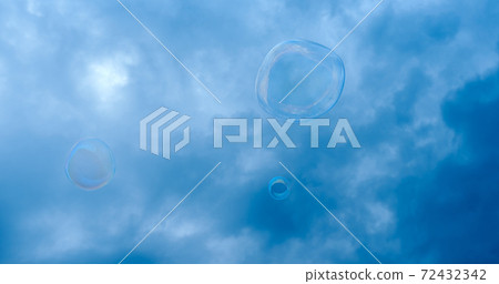 soap bubble against the background of a stormy dark blue sky soap bubble against the background of a stormy dark blue sky 72432342