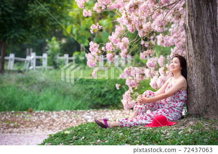 Beautiful woman in nature flower. 72437063