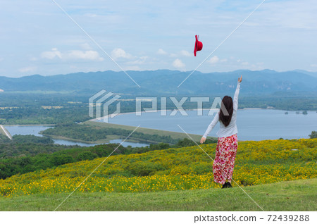 Beautiful woman in nature flower. 72439288