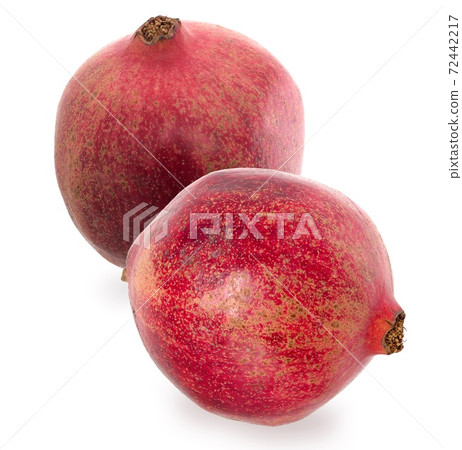 Two ripe red Garnet. Set fruits of red ripe pomegranate on the White Background. Vegetarian Concept. 72442217