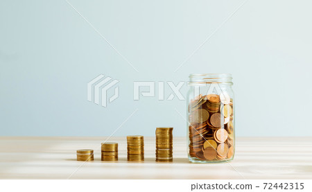 Plant on pile coins in the bottle, Money growing concept and the goal success. Plant on pile coins in the bottle, Money growing concept and the goal success. 72442315