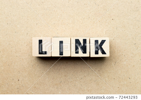 Letter block in word link on wood background Letter block in word link on wood background 72443293