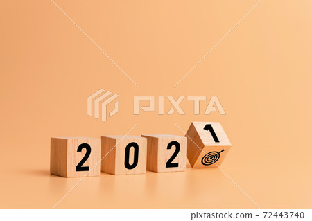 New year and goals for success concept, Text 2021 on wooden blocks on orange background. 72443740