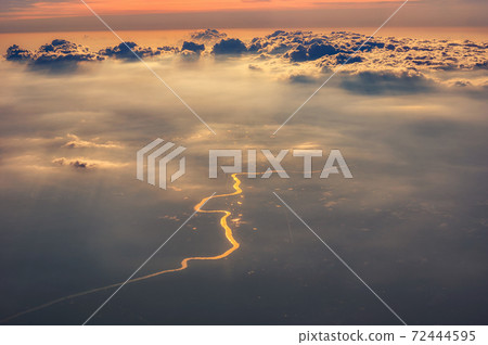 Golden river under cloud Golden river under cloud 72444595