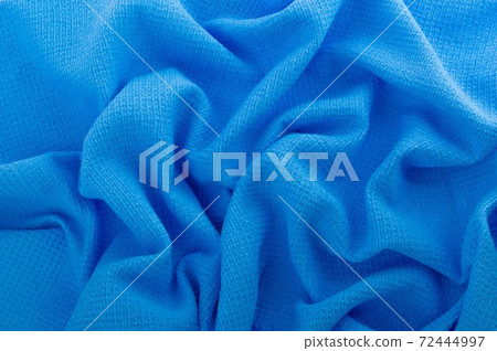 Blue fabric as a background. 72444997