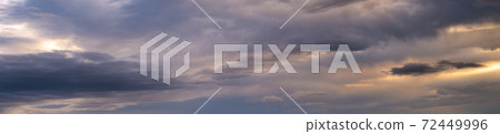 Fluffy clouds in evening overcast sky panoramic view. Climate, environment and weather concept sky background. 72449996