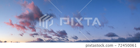 Fluffy clouds in evening overcast sky panoramic view. Climate, environment and weather concept sky background. 72450061
