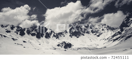 Black and white plateau in mountains and cloudy sky Black and white plateau in mountains and cloudy sky 72455111