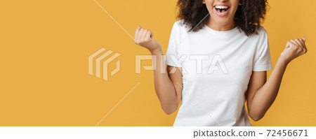 Victory, fulfillment of desires and success. Laughing millennial african american lady 72456671