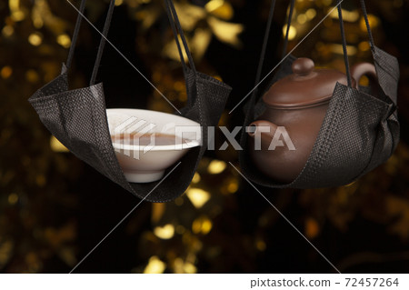 image of teapot cup dark background  72457264