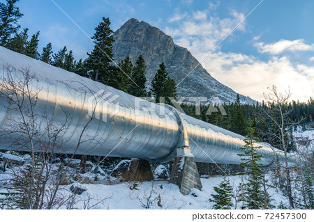 Big pipeline in Grassi Lakes hiking trail connects Whitemans Pond and Rundle Forebay. Hydro power system in Canmore, Alberta, Canada. Big pipeline in Grassi Lakes hiking trail connects Whitemans Pond and Rundle Forebay. Hydro power system in Canmore, Alberta, Canada. 72457300