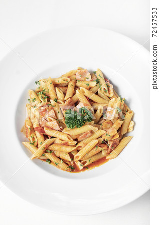 penne amatriciana tomato and ham sauce pasta on white table penne amatriciana tomato and ham sauce pasta on white table 72457533