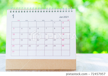 Calendar desk 2021 January month for organizer to plan and reminder on wooden table on nature background. 72457957