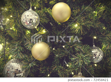 Christmas background of de-focused lights with decorated tree 72458421
