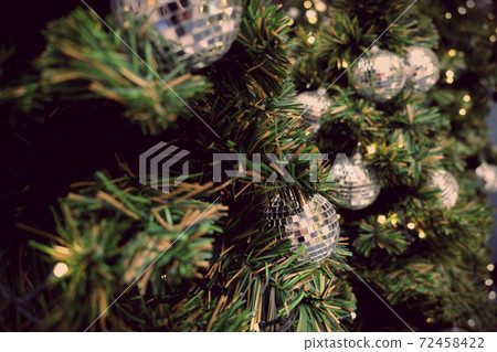 Christmas background of de-focused lights with decorated tree Christmas background of de-focused lights with decorated tree 72458422