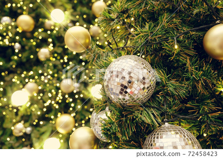 Christmas background of de-focused lights with decorated tree Christmas background of de-focused lights with decorated tree 72458423