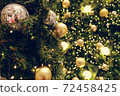 Christmas background of de-focused lights with decorated tree 72458425