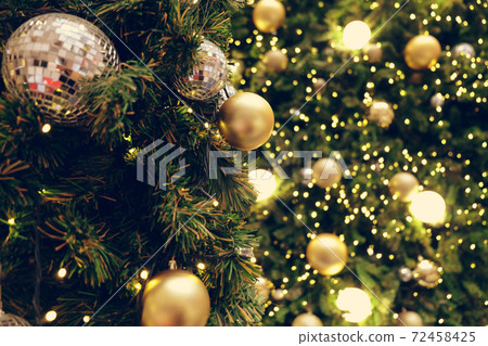 Christmas background of de-focused lights with decorated tree 72458425