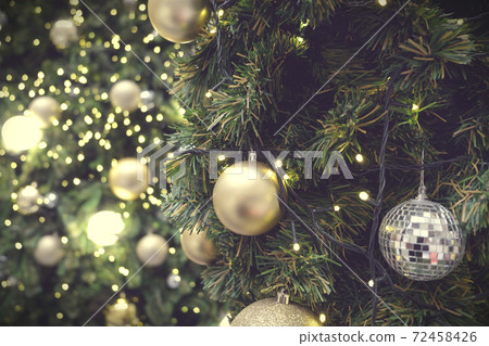 Christmas background of de-focused lights with decorated tree Christmas background of de-focused lights with decorated tree 72458426