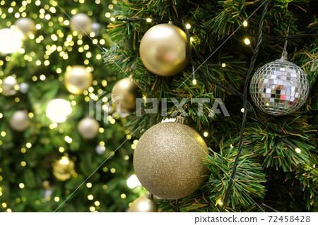 Christmas background of de-focused lights with decorated tree 72458428