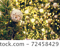 Christmas background of de-focused lights with decorated tree 72458429