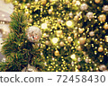 Christmas background of de-focused lights with decorated tree 72458430
