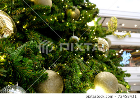Christmas background of de-focused lights with decorated tree Christmas background of de-focused lights with decorated tree 72458431