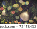 Christmas background of de-focused lights with decorated tree 72458432