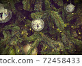 Christmas background of de-focused lights with decorated tree 72458433