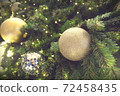 Christmas background of de-focused lights with decorated tree 72458435