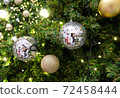 Christmas background of de-focused lights with decorated tree 72458444
