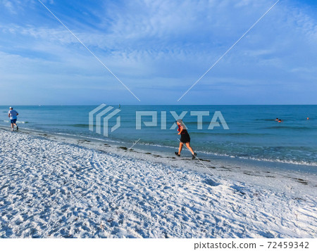 Beach walking on Siesta key beach 72459342