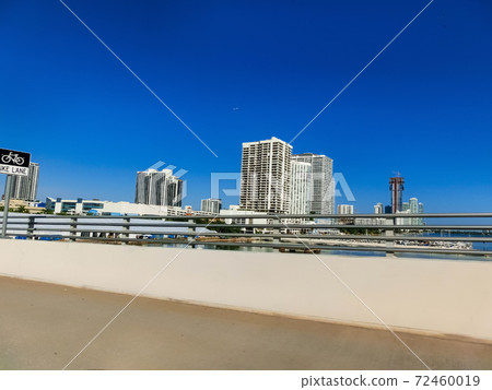 Miami skyscrapers with bridge over sea in the day. Miami skyscrapers with bridge over sea in the day. 72460019