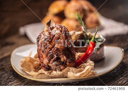 Ham hock baked with potatoes and served with a Ham hock baked with potatoes and served with a 72461908